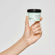 milk-shake-texturizing-cream-in-hand